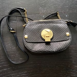 Celion Dion black purse. Lightly worn. New condition